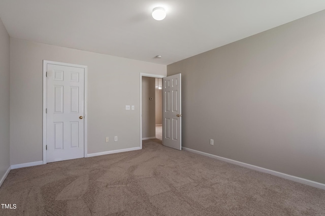 unfurnished bedroom with carpet floors