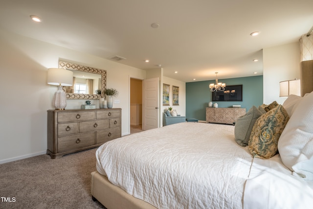 bedroom featuring a notable chandelier and carpet