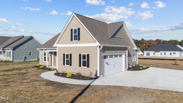 view of side of property with a garage