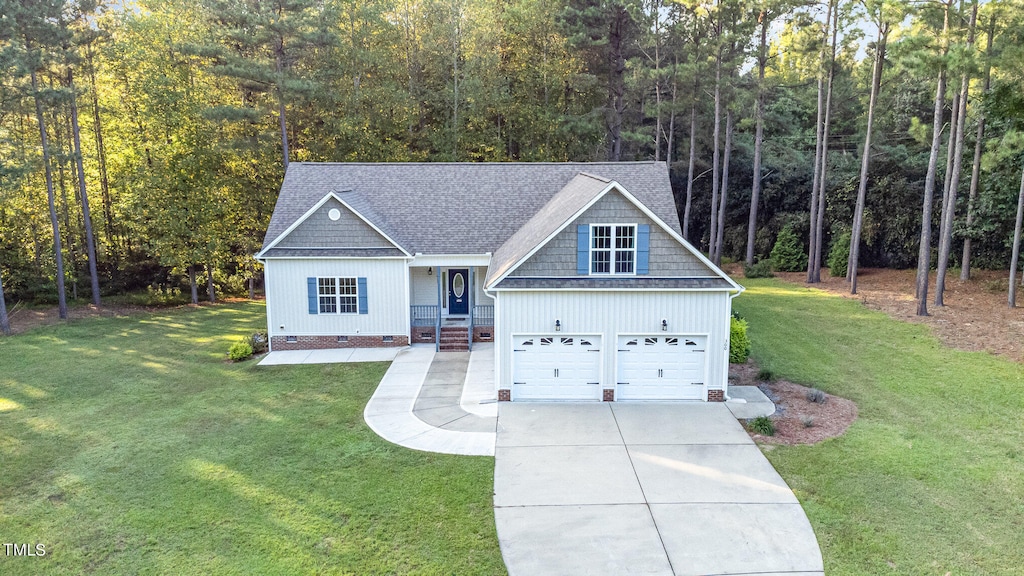 view of front of house with a front lawn and a garage