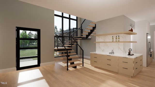 interior space featuring wood-type flooring and bar