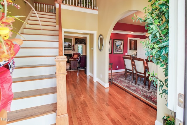 entrance foyer featuring hardwood / wood-style flooring and ornamental molding