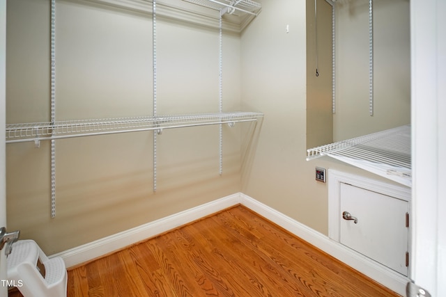 walk in closet featuring hardwood / wood-style floors