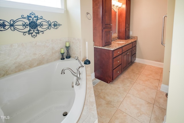 bathroom featuring a relaxing tiled tub, tile patterned floors, and vanity