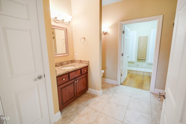 bathroom with tile patterned flooring and vanity