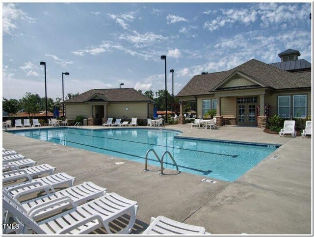 view of pool featuring a patio