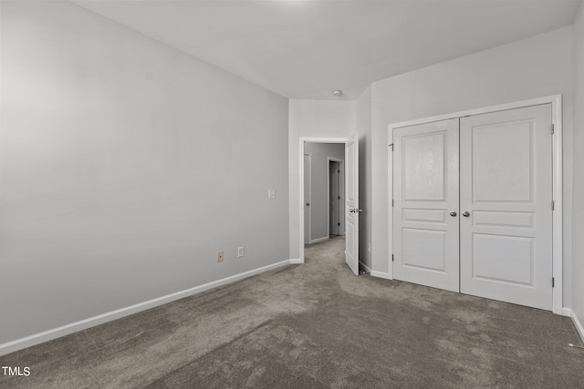 unfurnished bedroom featuring a closet and carpet floors