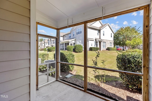 unfurnished sunroom featuring vaulted ceiling