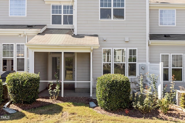 rear view of house with a sunroom