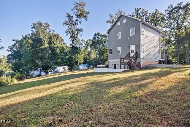 view of property exterior featuring a lawn