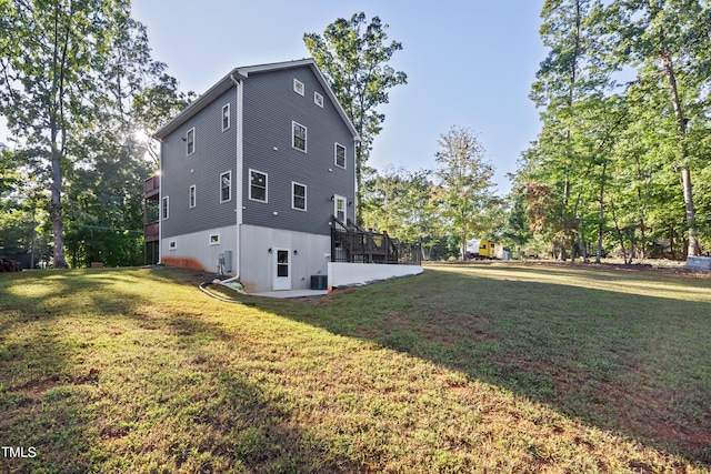 view of property exterior featuring a yard and a patio area