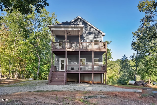 back of property featuring a wooden deck