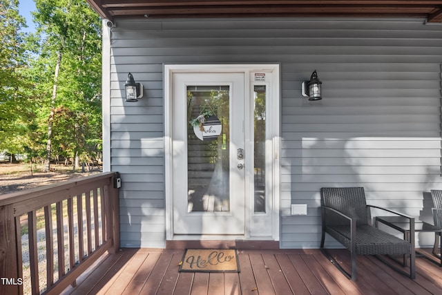 property entrance with a wooden deck