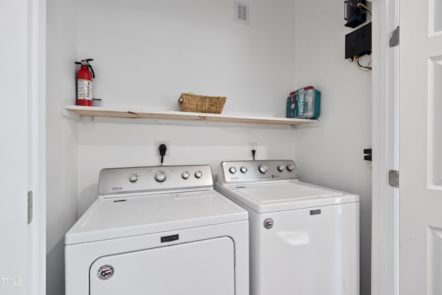 laundry room featuring independent washer and dryer