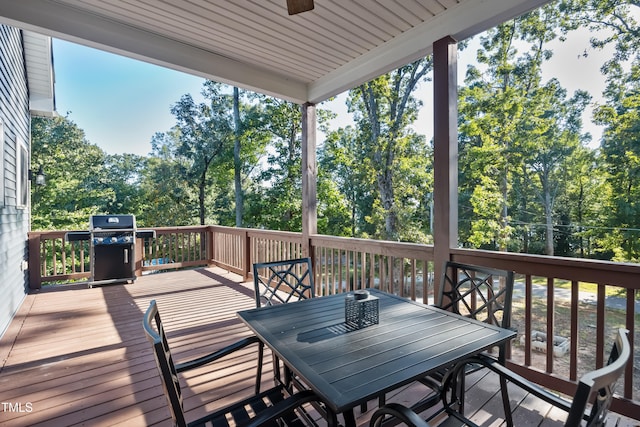 wooden terrace featuring grilling area