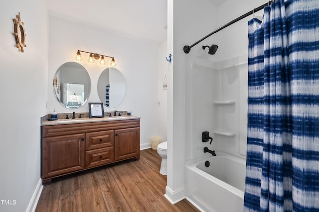 full bathroom with wood-type flooring, shower / bath combo, vanity, and toilet