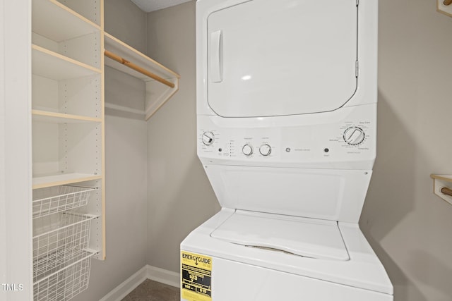 laundry room with stacked washer and clothes dryer