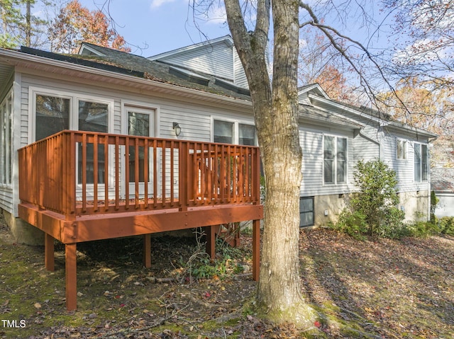 rear view of house featuring a deck