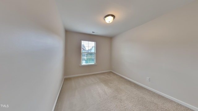 unfurnished room with carpet flooring