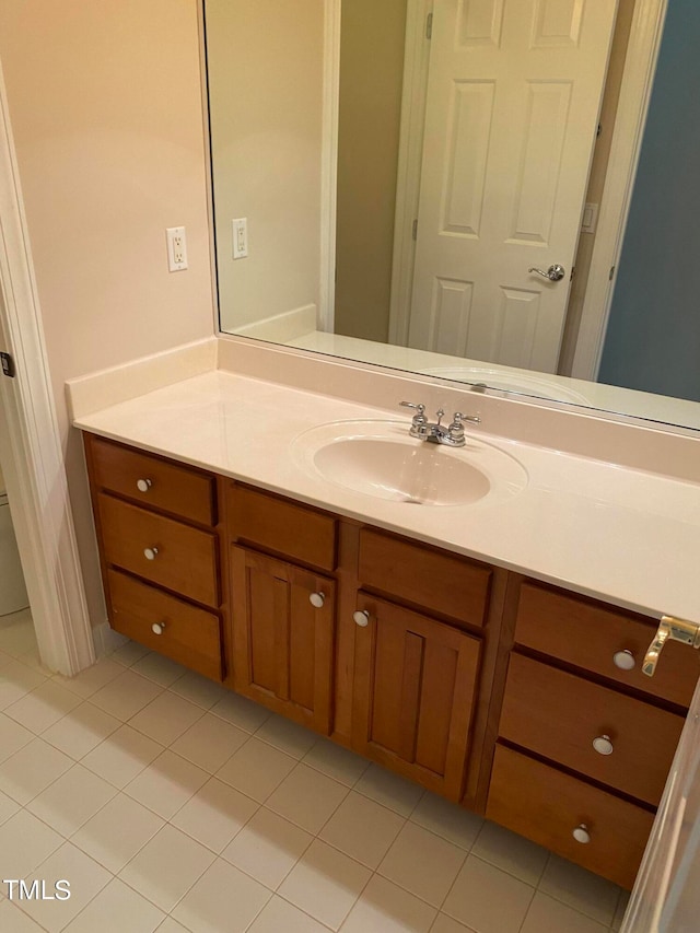 bathroom featuring tile patterned flooring and vanity