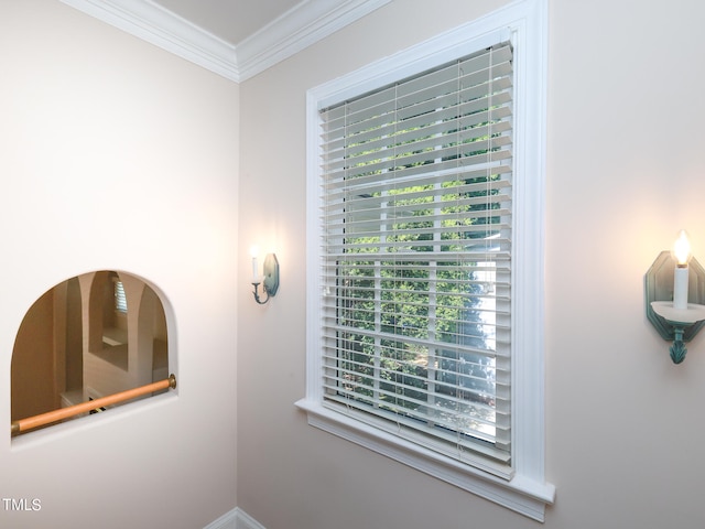 interior space with crown molding