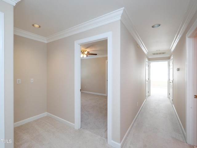 hall with light carpet and crown molding