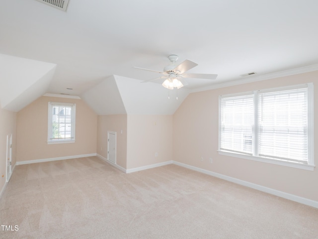 additional living space with light carpet, ceiling fan, and lofted ceiling