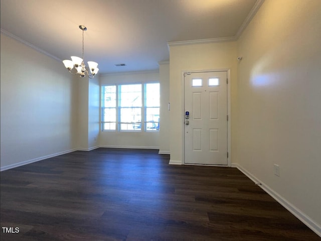 entrance foyer with a notable chandelier, dark hardwood / wood-style flooring, and crown molding