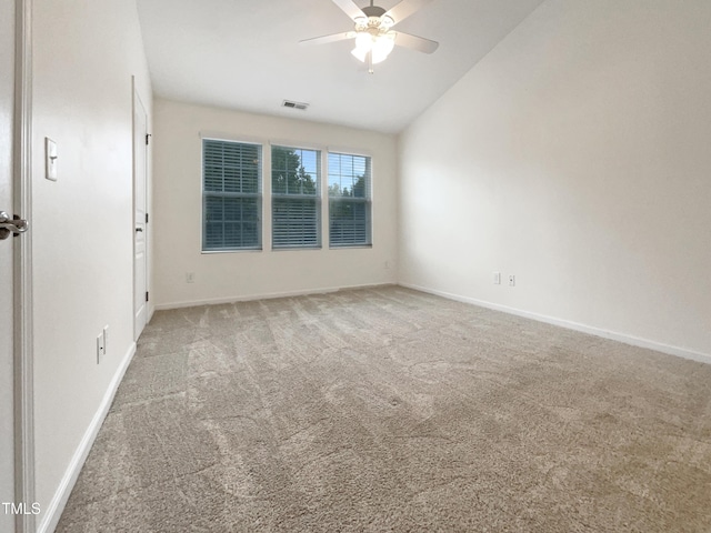 empty room featuring carpet floors, ceiling fan, and lofted ceiling