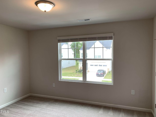 spare room featuring carpet flooring