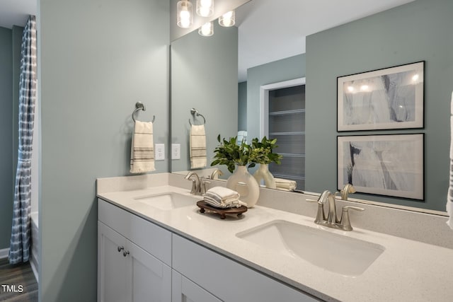 bathroom with vanity and hardwood / wood-style flooring