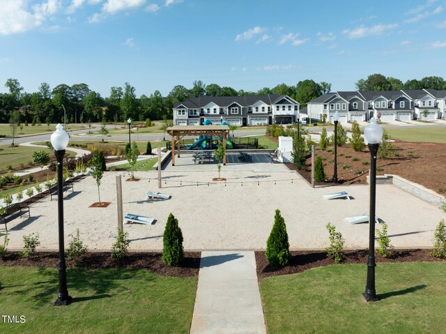 view of property's community featuring a yard