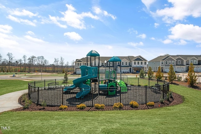 view of playground with a lawn