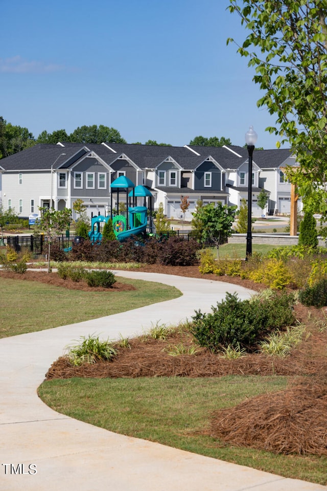 view of home's community featuring a playground