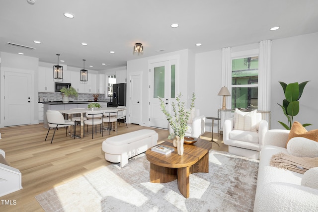 living room with light hardwood / wood-style floors