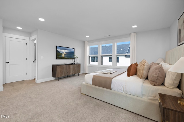 bedroom featuring light carpet