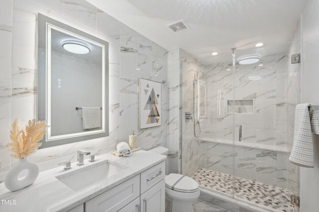 bathroom featuring walk in shower, vanity, and toilet