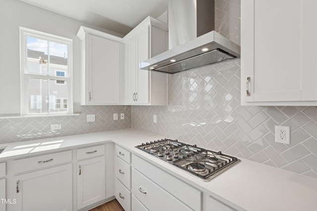 1206 Holding Village Way, Wake Forest, NC 27587 - kitchen featuring wall chimney range hood, stainless steel gas stovetop, light countertops, and white cabinets