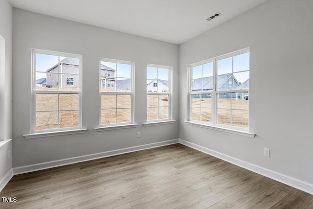 unfurnished room featuring light wood-type flooring