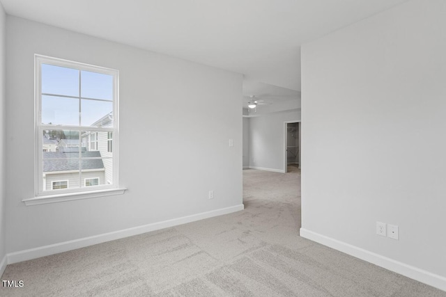 empty room featuring light colored carpet