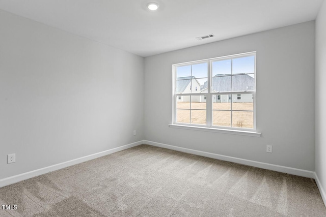 unfurnished room with carpet flooring