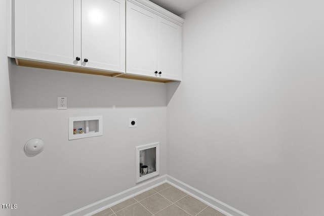 laundry room with cabinets, hookup for an electric dryer, hookup for a gas dryer, washer hookup, and light tile patterned flooring