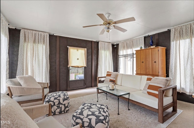 living room featuring a wealth of natural light and ceiling fan