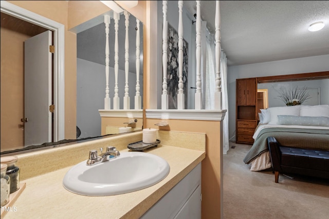 bathroom featuring vanity and a textured ceiling