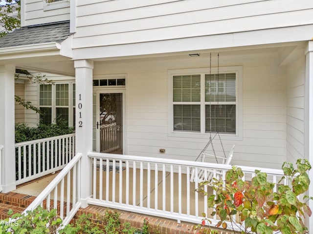 property entrance with covered porch