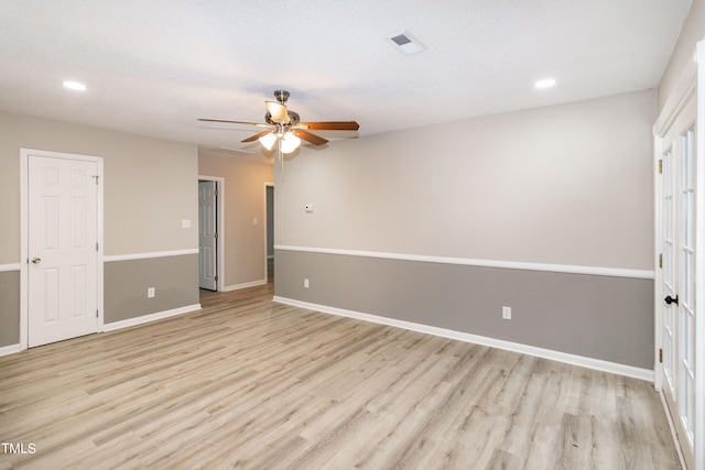 unfurnished room featuring ceiling fan and light hardwood / wood-style floors