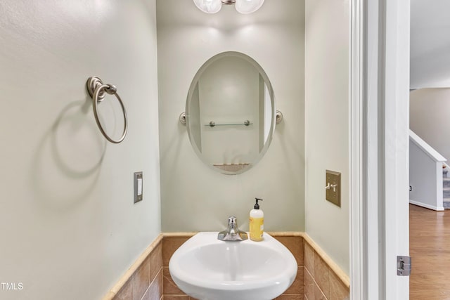 bathroom with hardwood / wood-style flooring and sink