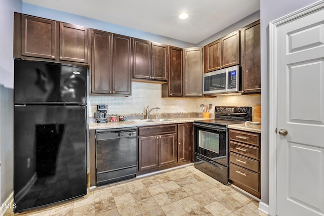 kitchen featuring tasteful backsplash, dark brown cabinetry, sink, and black appliances