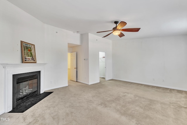 unfurnished living room with ceiling fan and light colored carpet