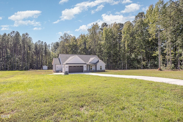 view of front of home featuring a garage and a front yard